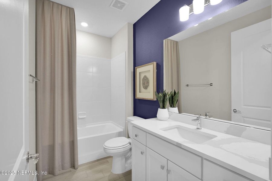 Furnished interior view inside a new home in Summer Bay at Grand Oaks, St. Augustine (Image 32).