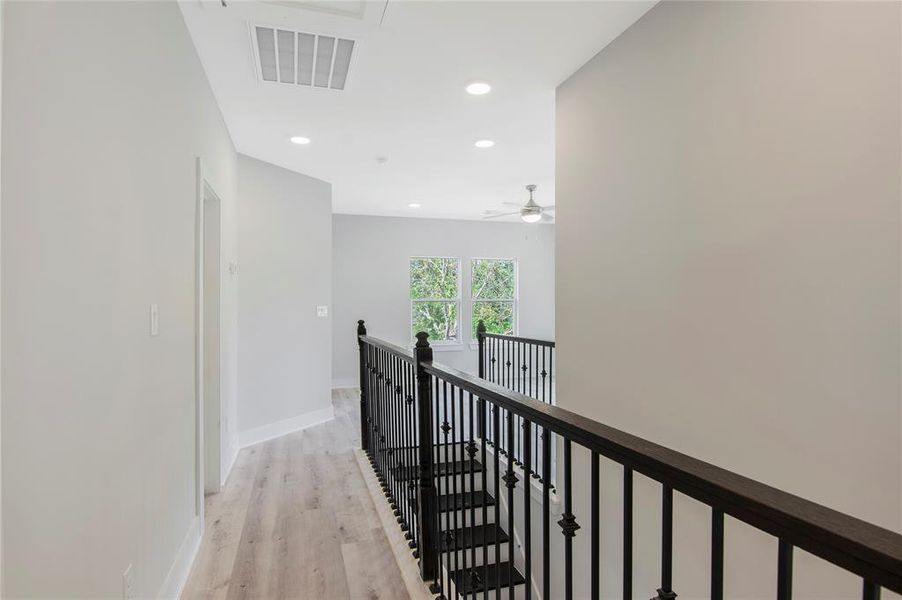 View of hallway into game room from secondary bedroom.