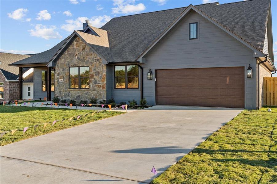 Front exterior of a new home in , Lindale, TX, highlighting curb appeal (Image 1). Front exterior of a new home in , Lindale, TX, highlighting curb appeal (Image 1).