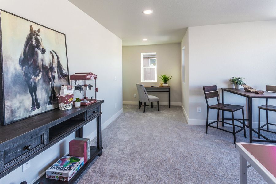 Representative furnished interior of a home built from the Tesla by Hartford Homes in Trailside, Timnath (Image 16).