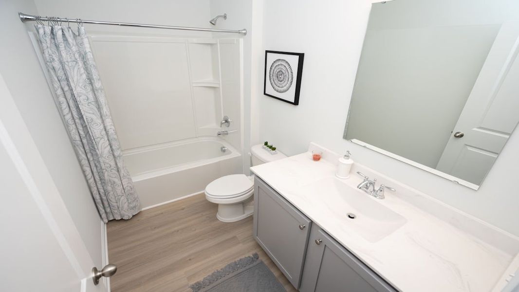 Representative furnished interior of a home built from the KERRY by D.R. Horton in Lochaven, Conway (Image 9).