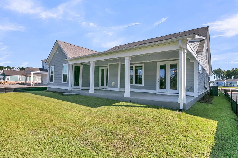 Exterior details and patio area of a home in Tidewater at Lakes of Cane Bay, Summerville (Image 3). Exterior details and patio area of a home in Tidewater at Lakes of Cane Bay, Summerville (Image 3).
