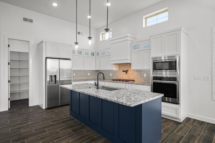 Representative furnished interior of a home built from the Scottsdale by LEH. Homes in Verdancia, El Paso (Image 10).