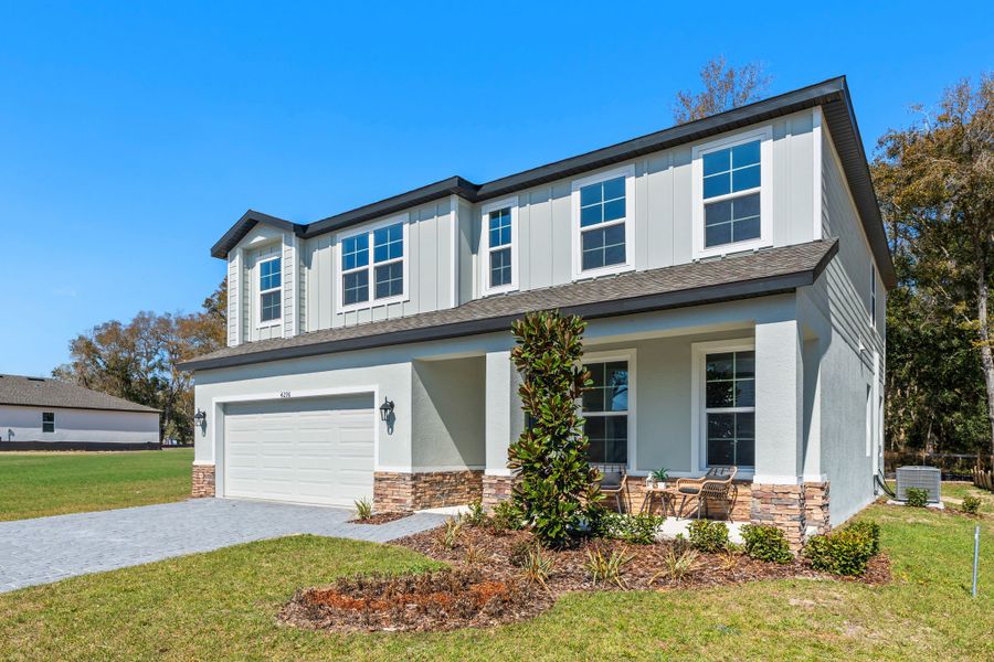Representative exterior photo of a completed home built from the Guinevere by Hartizen Homes in Estes Reserve, Eustis, FL (Image 19).