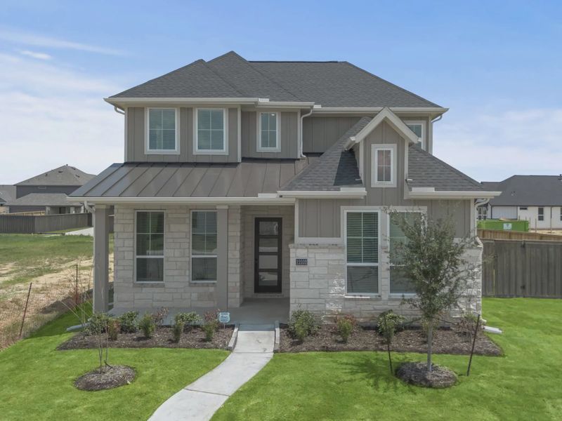 Representative exterior photo of a completed home built from the St Andrews by Chesmar Homes in Riceland Alley Loads, Mont Belvieu, TX (Image 26).