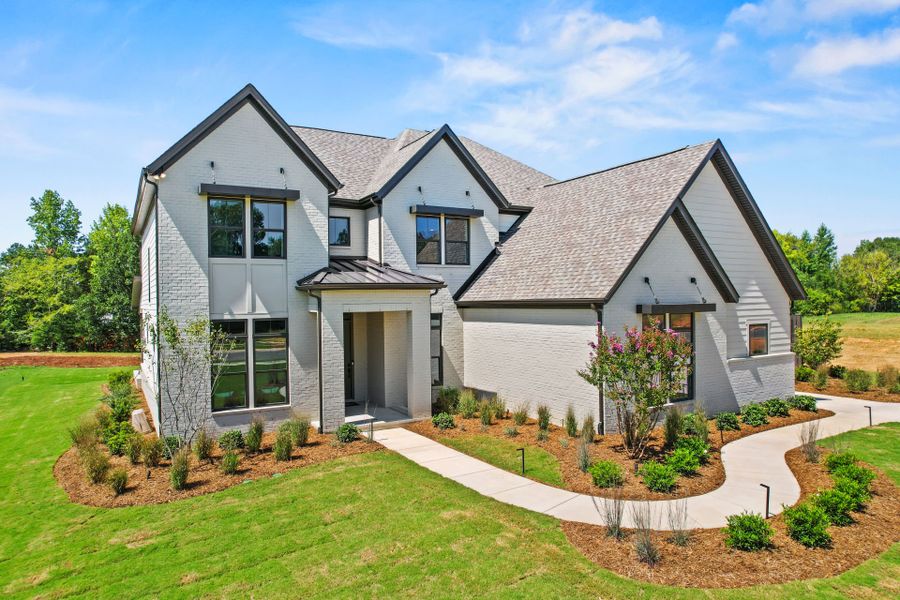 Representative exterior photo of a completed home built from the Hampton by John Wieland in McCoy Farm, Wesley Chapel, NC (Image 28).