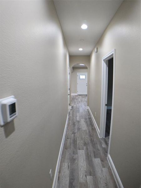 Corridor featuring dark wood-type flooring