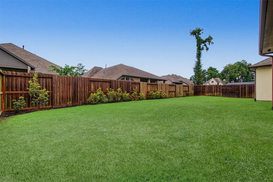 Exterior details and patio area of a home in The Highlands, Porter (Image 21).