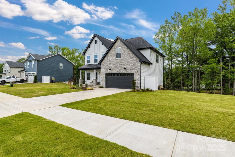 Front exterior of a new home in , Kannapolis, NC, highlighting curb appeal (Image 25).