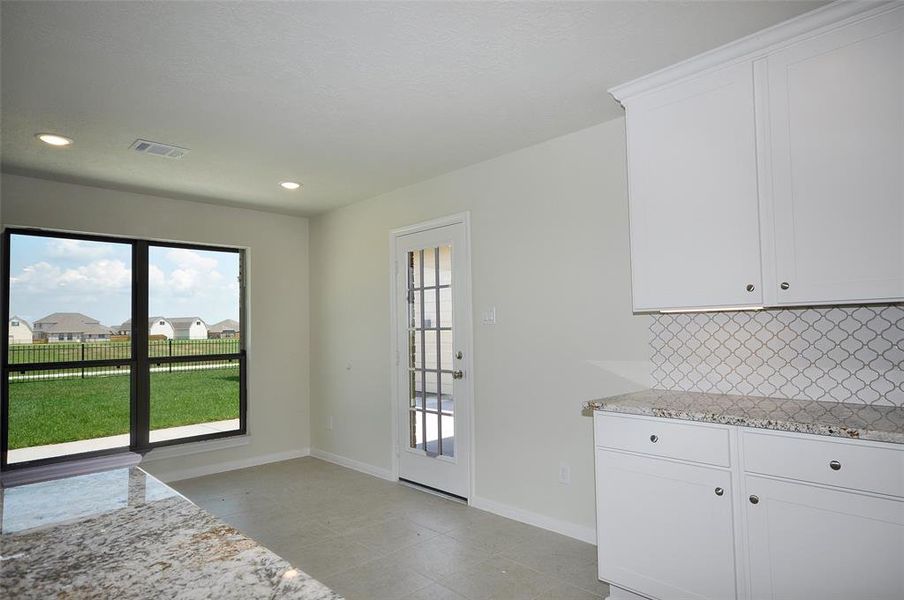 Enjoy a view across your back yard out to the lake from the breakfast room.