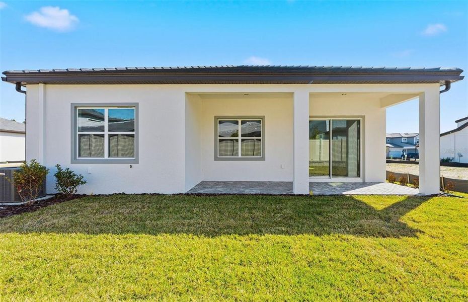 Exterior details and patio area of a home in Two Rivers, Zephyrhills (Image 3).