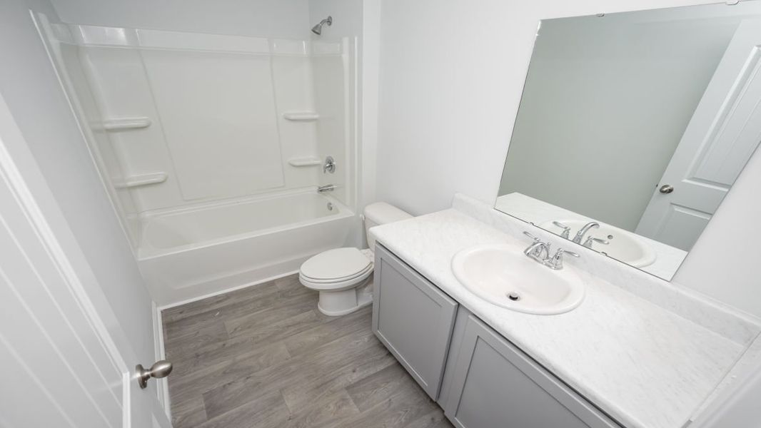 Representative furnished interior of a home built from the KERRY by D.R. Horton in Stanbury Creek, Supply (Image 4).