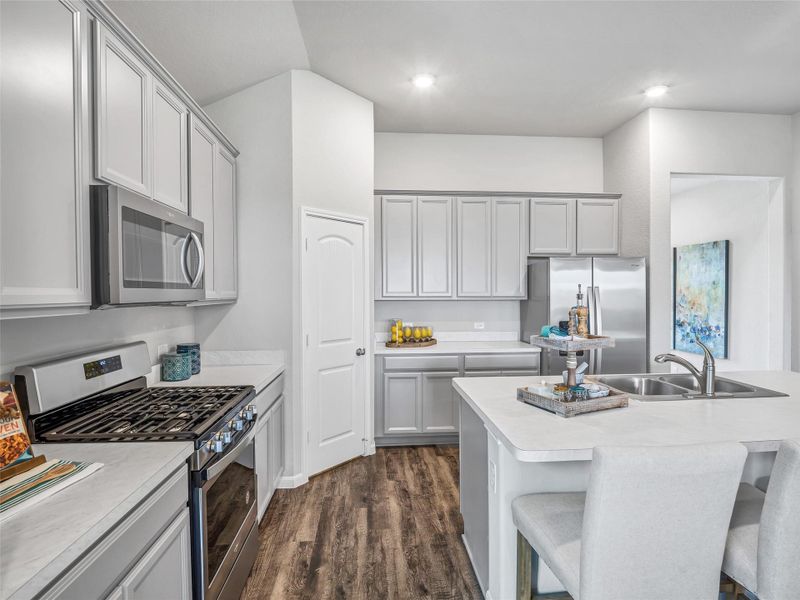 This generously spacious kitchen is a dream realized! Sample photo of completed home with similar floor plan. Actual colors and selections may vary. This generously spacious kitchen is a dream realized! Sample photo of completed home with similar floor plan. Actual colors and selections may vary.