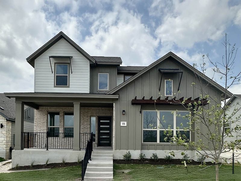 Front exterior of a new home in Sage Hollow, Kyle, TX, highlighting curb appeal (Image 4).