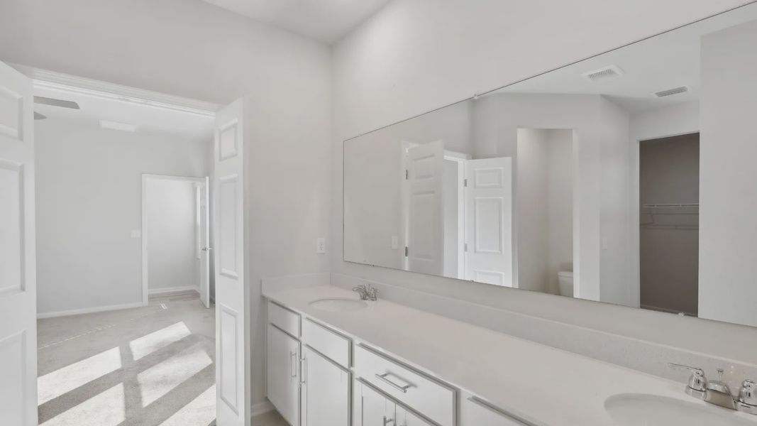 Experience luxury living with modern fixtures in this elegantly designed residential bathroom home architecture.