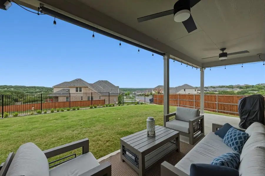 The property features an expansive outdoor living area with Hill Country Views