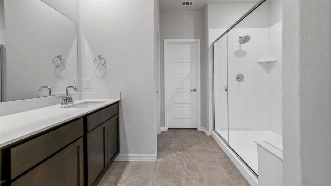 Full bathroom with vanity and a stall shower Full bathroom with vanity and a stall shower