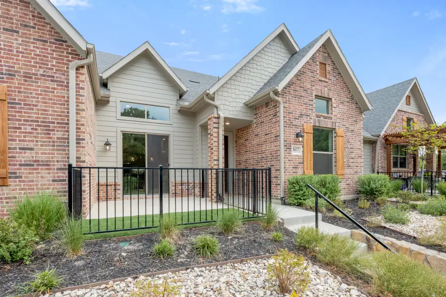 Front exterior of a new home in Cottonwood Creek, Rowlett, TX, highlighting curb appeal (Image 28).