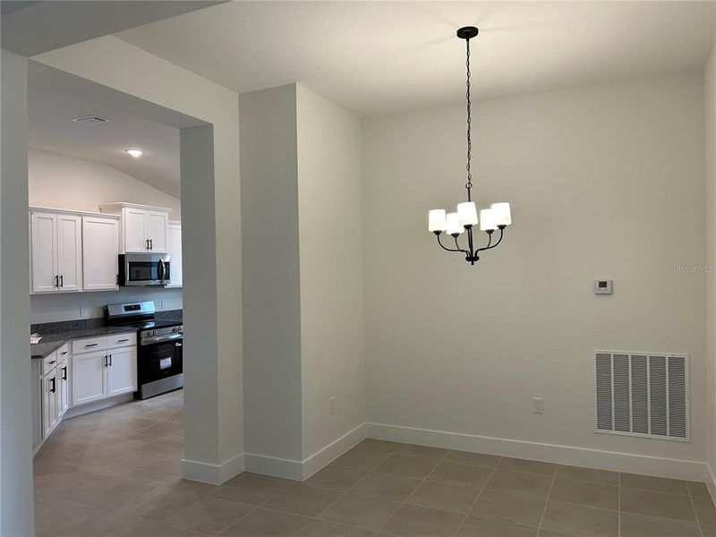 Spacious, unfurnished interior of a new home in Watercress Cove, North Port (Image 18).