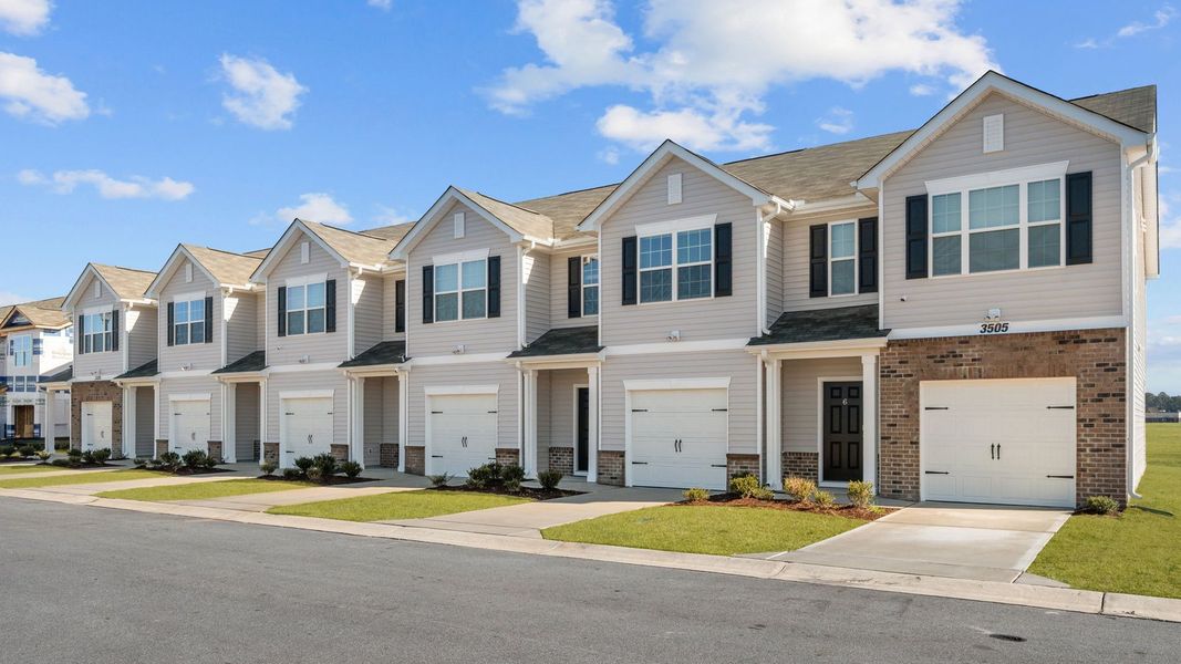 Front exterior of a new home in The Townes at Ridgewood Farms, Winterville, NC, highlighting curb appeal (Image 19).