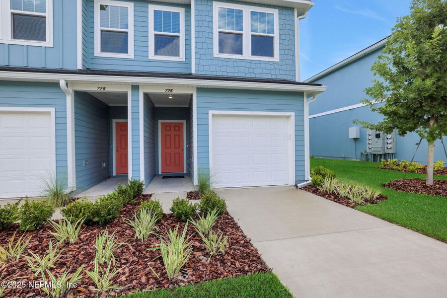 Front exterior of a new home in Kasen Oaks, Jacksonville, FL, highlighting curb appeal (Image 18).