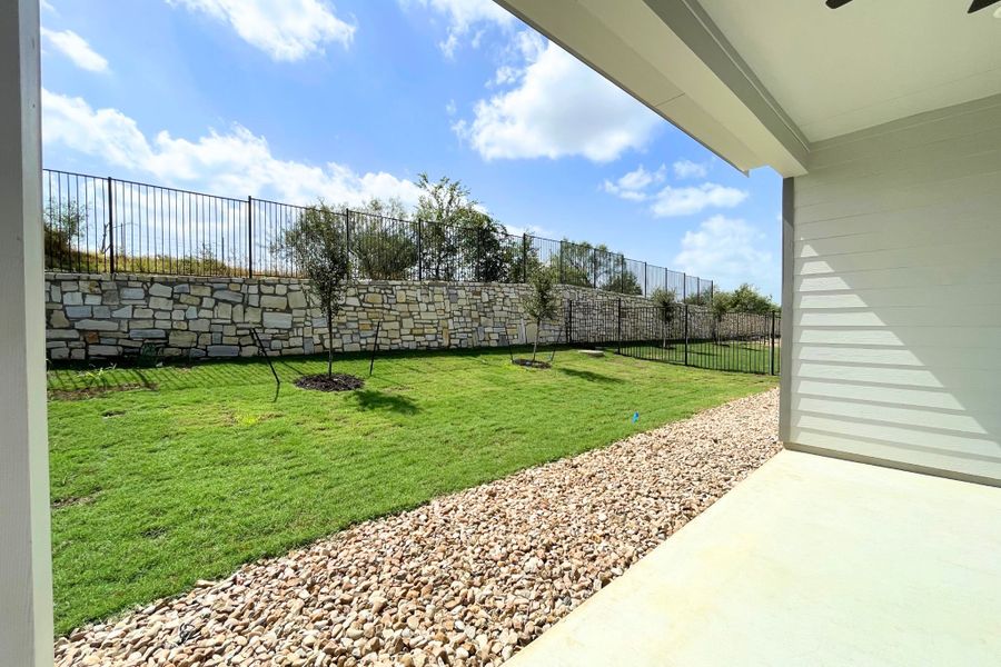Exterior details and patio area of a home in Whisper Valley, Manor (Image 3).