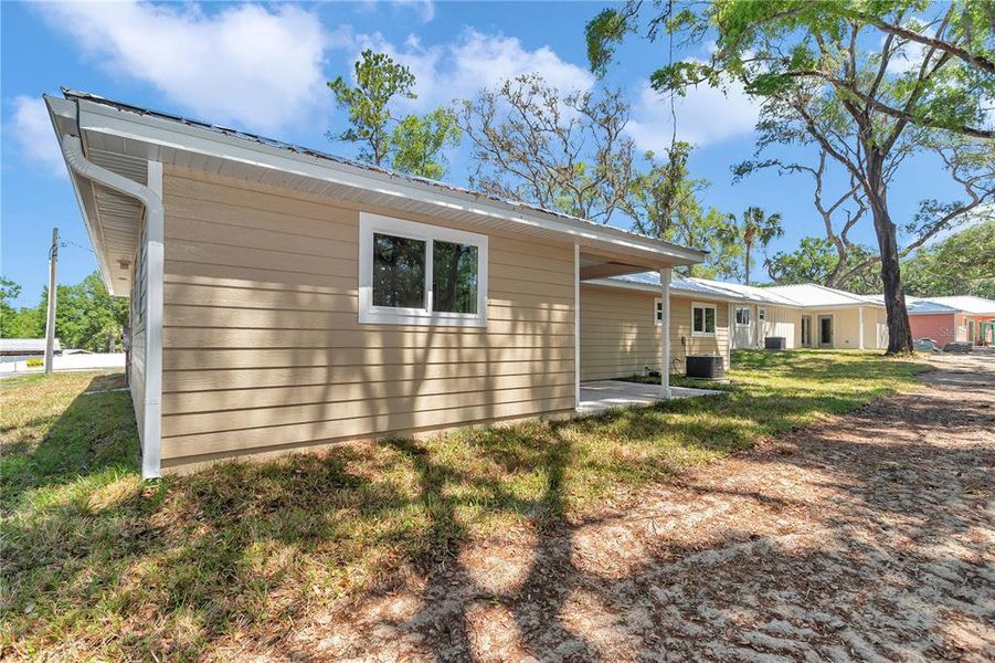 Front exterior of a new home in , Dunnellon, FL, highlighting curb appeal (Image 1).