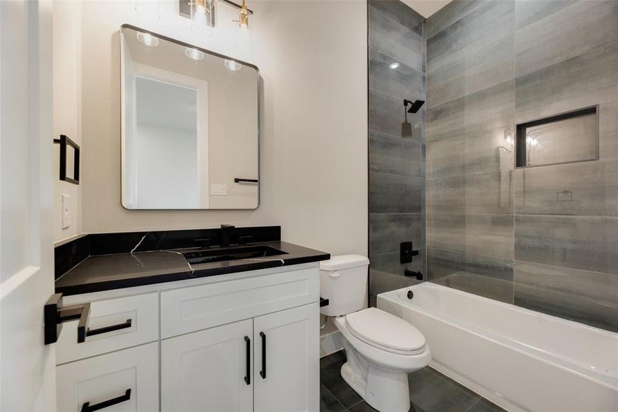 Full bathroom with vanity and shower / tub combination