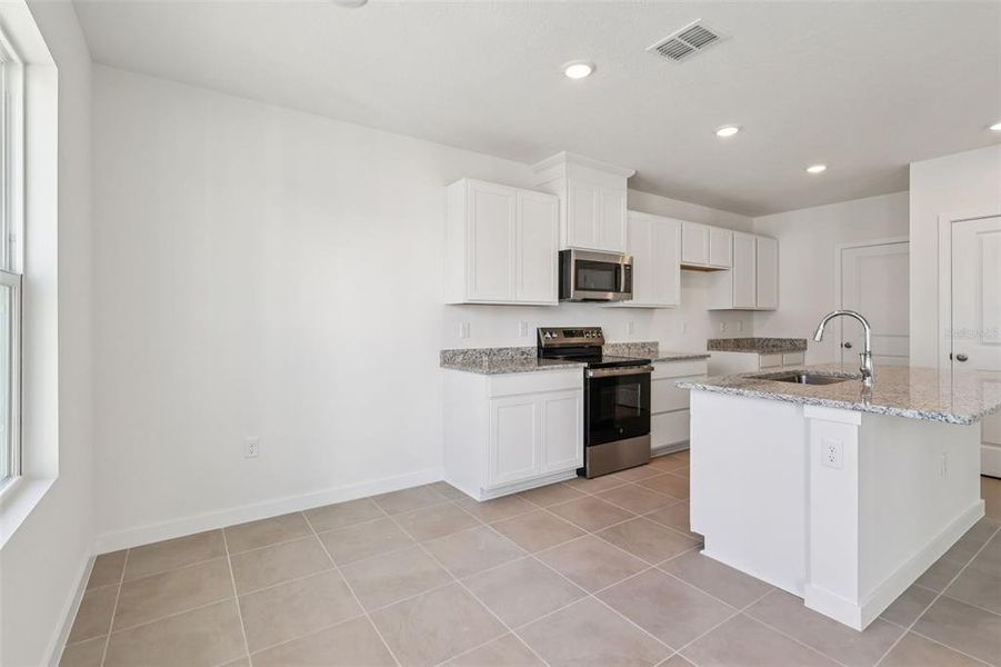Furnished interior view inside a new home in Cyrene at Harmony, St. Cloud (Image 11).