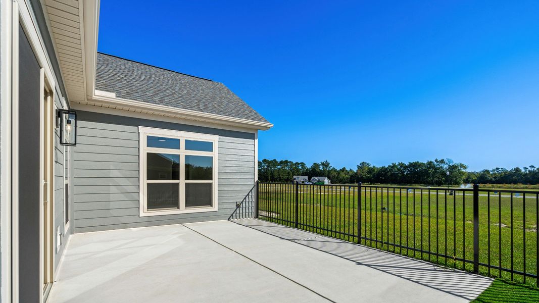 Exterior details and patio area of a home in Courtyards by Carrell, Ocean Isle Beach (Image 18). Exterior details and patio area of a home in Courtyards by Carrell, Ocean Isle Beach (Image 18).