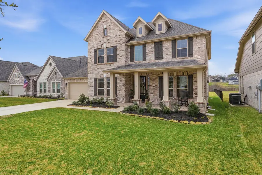 Front exterior of a new home in Waterstone on Lake Conroe, Montgomery, TX, highlighting curb appeal (Image 23).