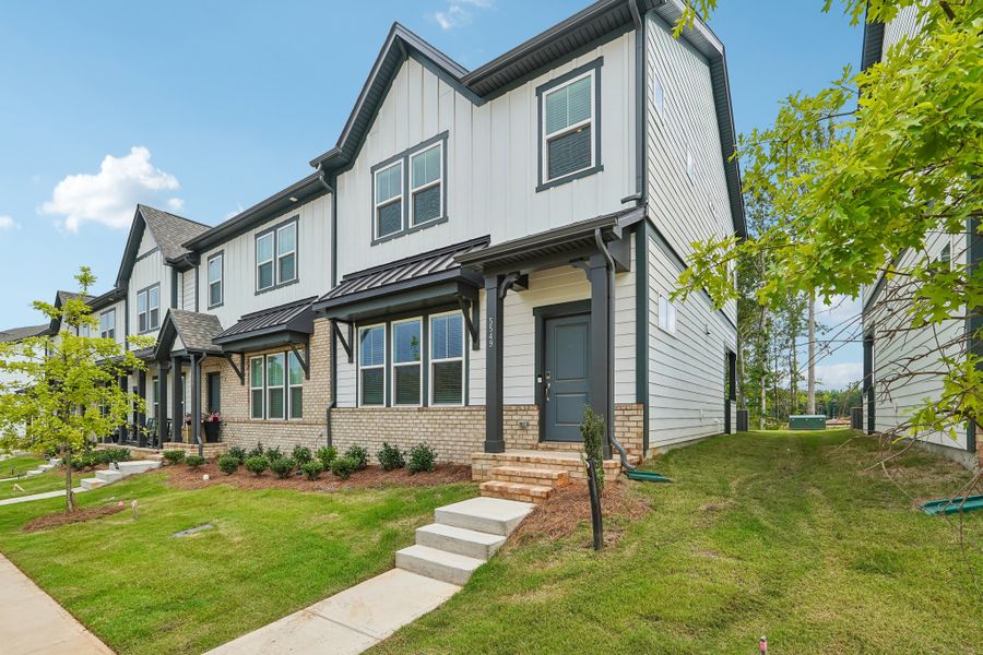 Front exterior of a new home in Terraces at the Exchange, Indian Land, SC, highlighting curb appeal (Image 18).