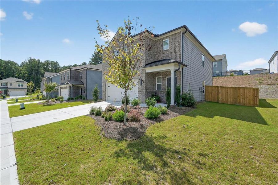 Front exterior of a new home in , Union City, GA, highlighting curb appeal (Image 26).