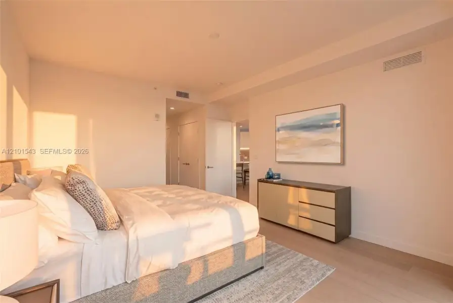 Neutral-toned interior featuring wood-finish flooring, recessed lighting, and crisp wall finishes