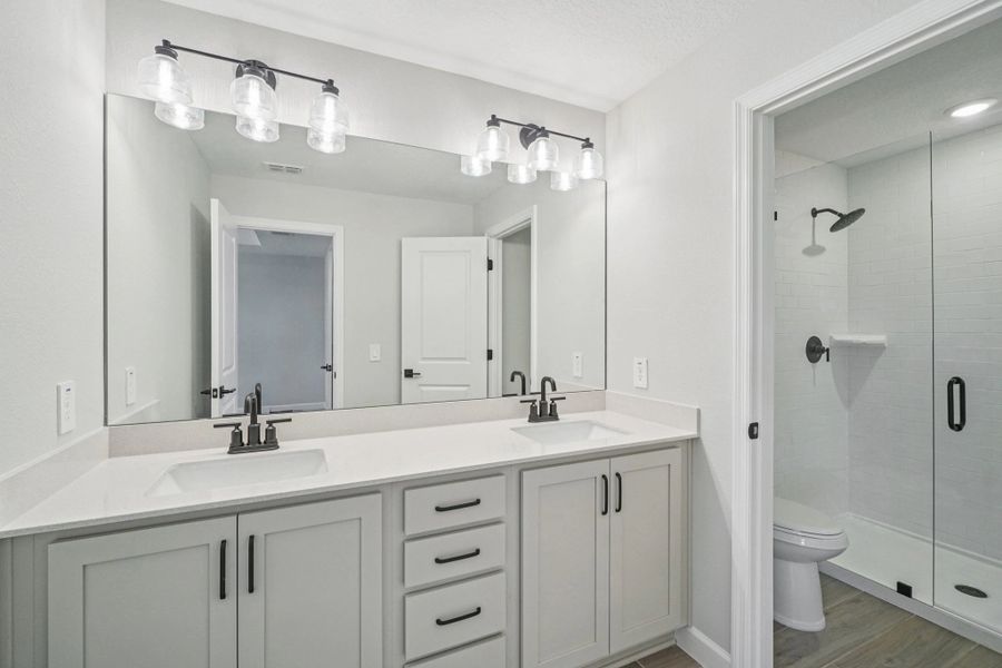 Luxurious primary bathroom featuring AW Collection® Artisan