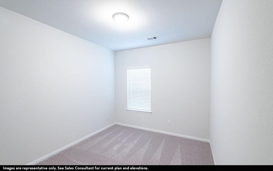 Carpeted empty room featuring baseboards and visible vents