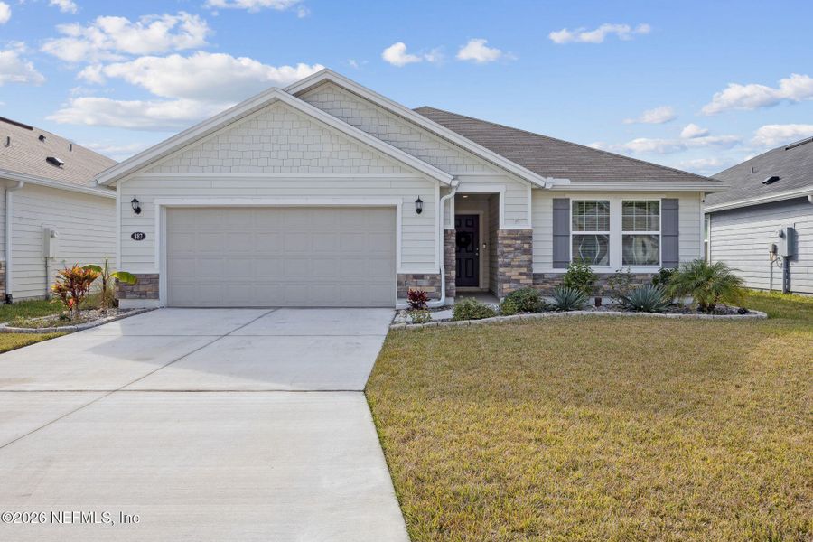 Front exterior of a new home in Panther Creek, Jacksonville, FL, highlighting curb appeal (Image 1). Front exterior of a new home in Panther Creek, Jacksonville, FL, highlighting curb appeal (Image 1).