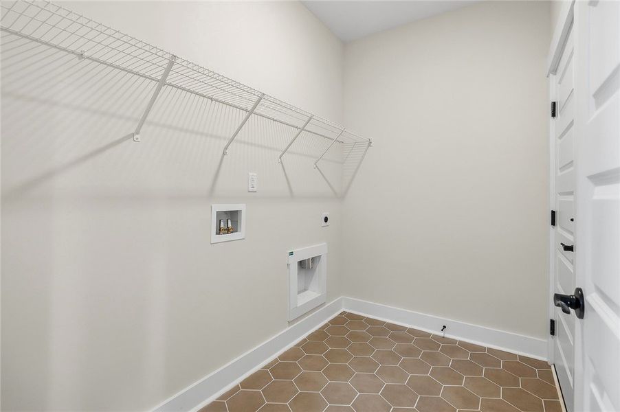 Geometric tile flooring and wire shelving define t