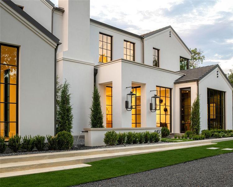 Rear view of property featuring stucco siding Rear view of property featuring stucco siding