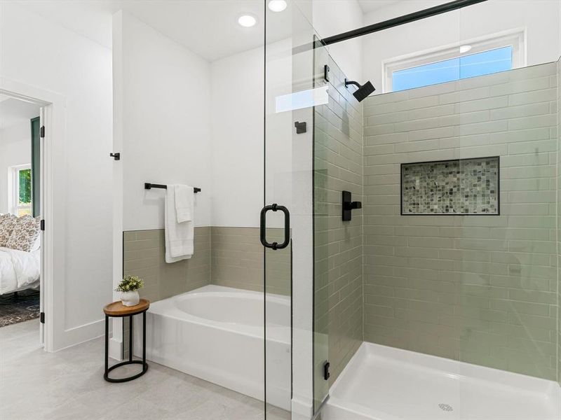 Ensuite bathroom featuring a shower stall, a bath, and recessed lighting