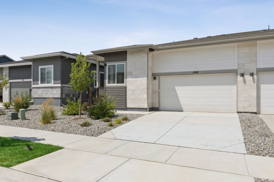 Front exterior of a new home in Westside Crossing, Berthoud, CO, highlighting curb appeal (Image 2). Front exterior of a new home in Westside Crossing, Berthoud, CO, highlighting curb appeal (Image 2).