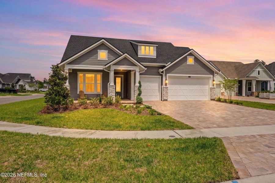 Front exterior of a new home in Oak Grove at SilverLeaf 60’, St. Augustine, FL, highlighting curb appeal (Image 22).
