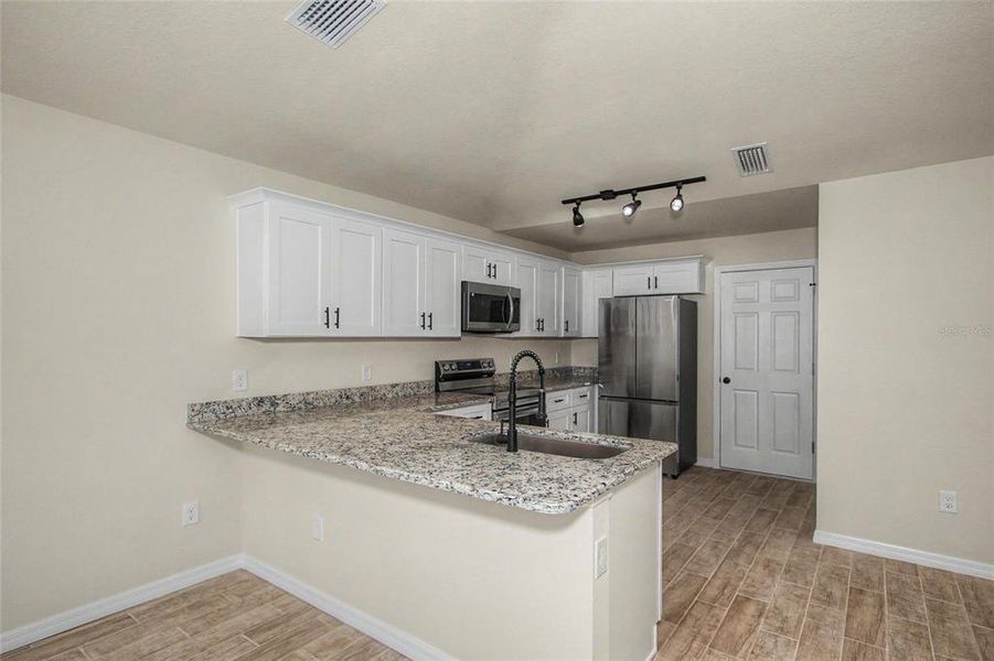 Furnished interior view inside a new home in , Ocala (Image 12). Furnished interior view inside a new home in , Ocala (Image 12).