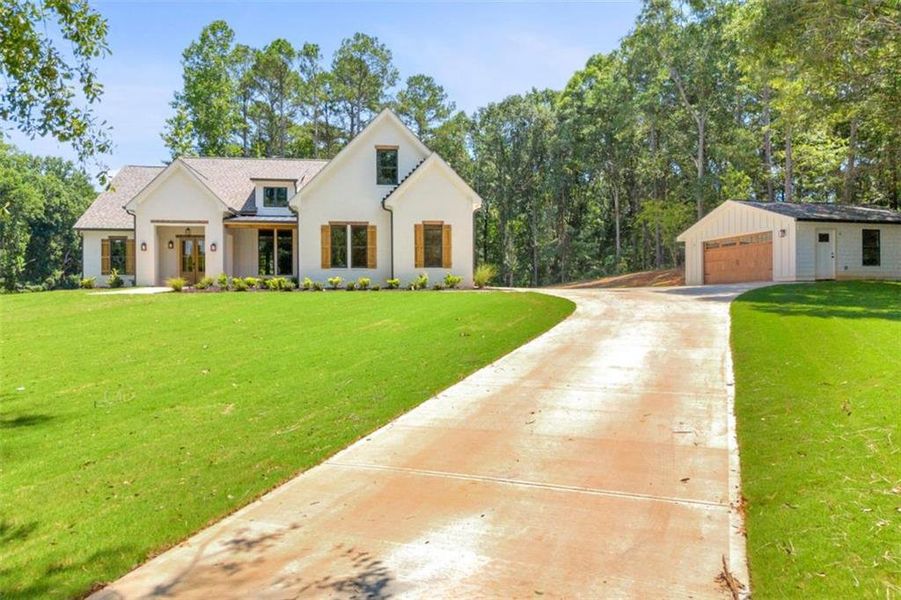 Front exterior of a new home in , Monroe, GA, highlighting curb appeal (Image 24). Front exterior of a new home in , Monroe, GA, highlighting curb appeal (Image 24).