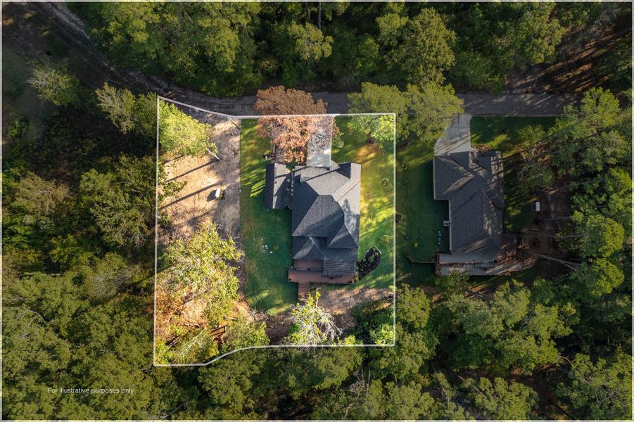 This aerial view showcases a spacious property surrounded by lush trees, offering a sense of privacy. The home features a well-maintained yard and is situated in a serene, wooded area with a neighboring house nearby. Ideal for those seeking tranquility and natural beauty. This aerial view showcases a spacious property surrounded by lush trees, offering a sense of privacy. The home features a well-maintained yard and is situated in a serene, wooded area with a neighboring house nearby. Ideal for those seeking tranquility and natural beauty.