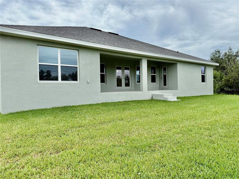 Front exterior of a new home in South Gulf Cove, Port Charlotte, FL, highlighting curb appeal (Image 13).