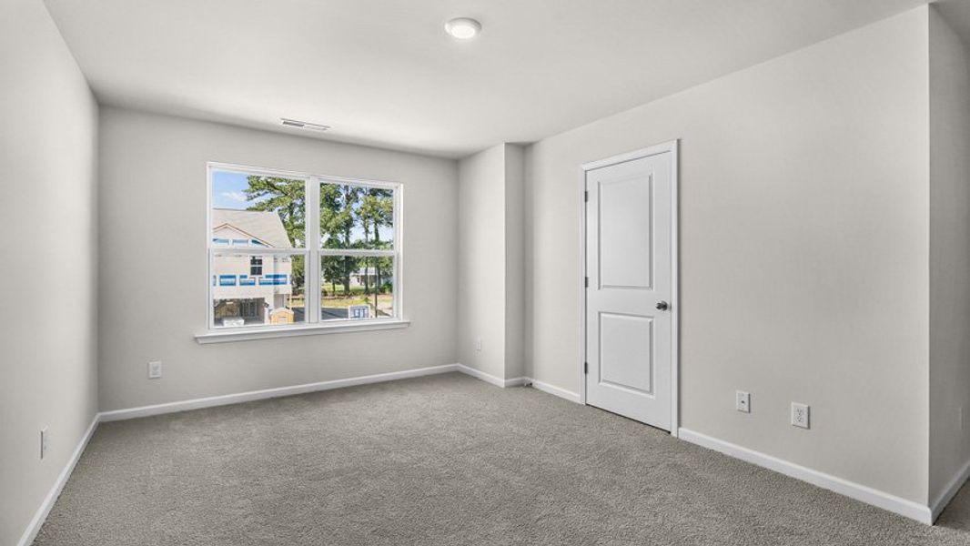 Spacious, unfurnished interior of a new home in Edinborough Townes, Gibsonville (Image 13).