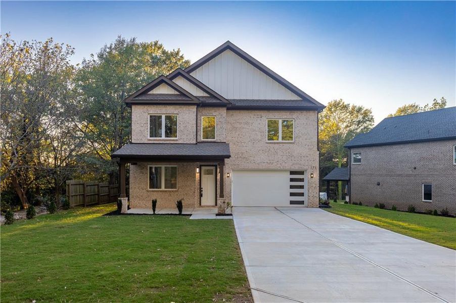 Front exterior of a new home in , Lawrenceville, GA, highlighting curb appeal (Image 1). Front exterior of a new home in , Lawrenceville, GA, highlighting curb appeal (Image 1).