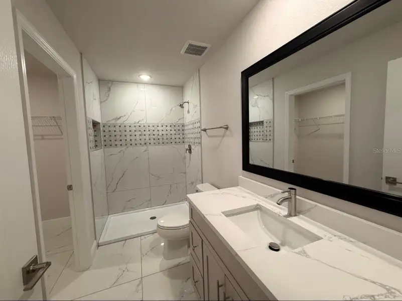 Furnished interior view inside a new home in , Kissimmee (Image 8).