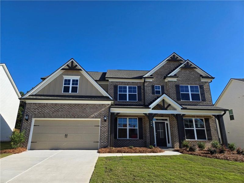 Front exterior of a new home in Enclave at Logan Point, Loganville, GA, highlighting curb appeal (Image 23). Front exterior of a new home in Enclave at Logan Point, Loganville, GA, highlighting curb appeal (Image 23).